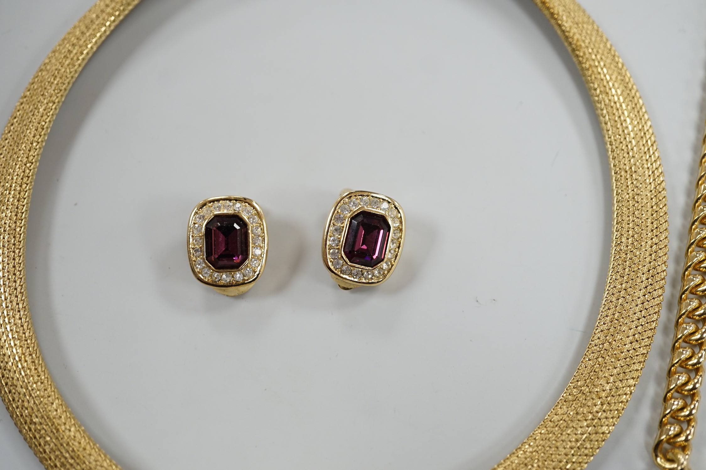 A modern Christian Dior gilt metal and two colour paste set necklace, 37cm and a pair of matching ear clips and one other Christian Dior necklace.